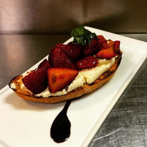 Russell House toast with house-made ricotta and rosemary balsamic-tossed strawberries
